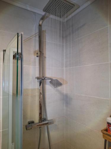 a shower with a glass door in a bathroom at Label Semois-L'Orée des sens-Bain nordique privé in Bouillon