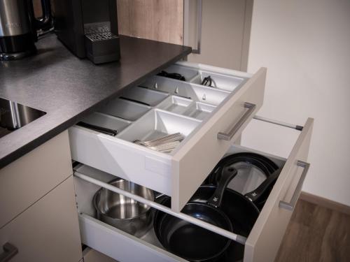 a kitchen with an open drawer with a washing machine at Farmhouse in Schwendau with Ski Storage in Hippach