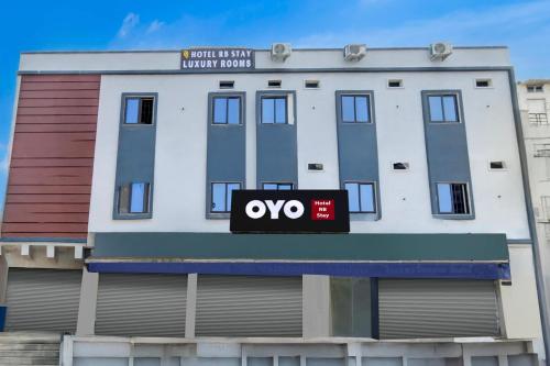 a apartment building with an oo sign on it at Hotel O RB STAY in Haidar Sāhibgūda