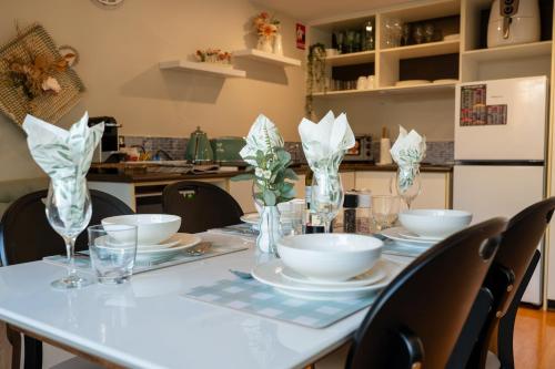 a table with plates and bowls on top of it at Serenity & Sea at Preston Beach WA in Preston Beach