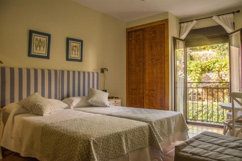 Ένα ή περισσότερα κρεβάτια σε δωμάτιο στο Casa Rural Fuente El Boticario