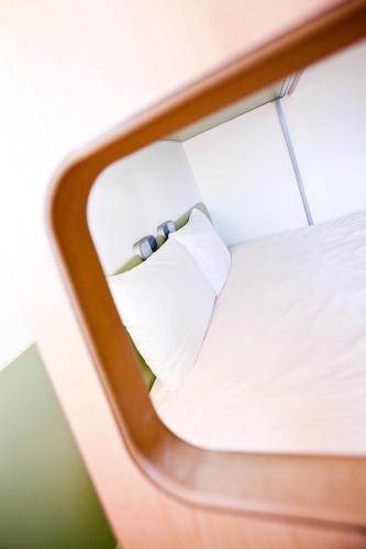 a close up of a window of a bed at Ibis Budget Sarrebourg Buhl in Sarrebourg