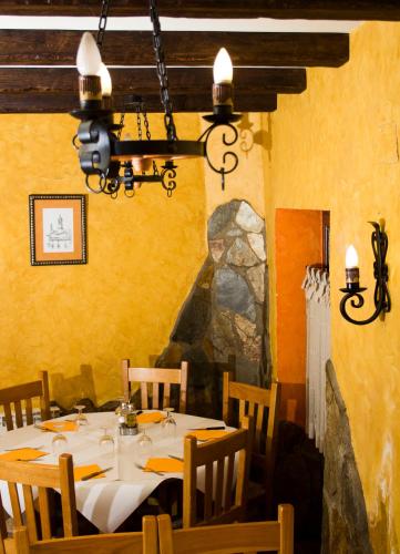 a dining room with a table in a restaurant at Hostal El Bodegon in Ateca