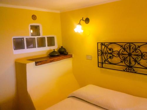 Ένα ή περισσότερα κρεβάτια σε δωμάτιο στο Marulivo Hotel