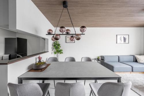 a dining room with a table and chairs at Hills Niseko A in Niseko