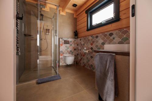 a bathroom with a shower and a sink at Bükk Hill Garden in Miskolc