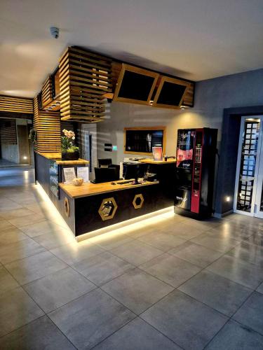 a kitchen with a counter and a refrigerator at Hotel Fabrica in Liberec