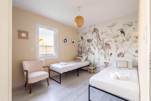 a room with two beds and a chair at Nouveau ! Bulle d'air - Maison avec piscine in Bouaye