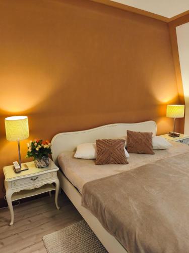 a bedroom with a bed with two pillows on it at Watt in Karolinenkoog