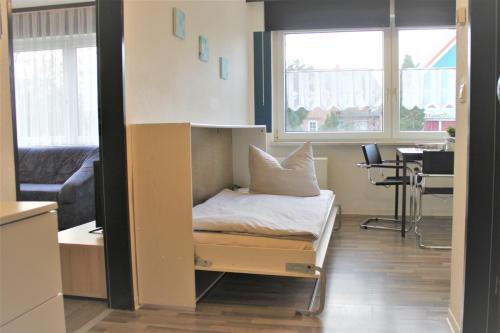 a room with a bed in a room with a window at Am Langenwerder Whg 4 in Gollwitz