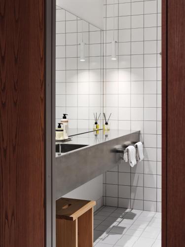 a bathroom with a sink and a mirror at Ottilia Heritage in Copenhagen