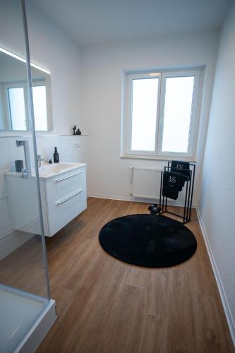 a bathroom with a sink and a mirror at JS-Business in Balingen