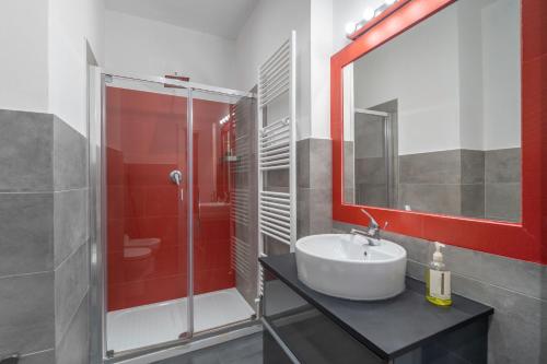 a bathroom with a sink and a shower at Excelsior in Piombino