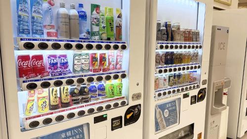 a vending machine filled with lots of bottles of soda at Toyoko Inn Tsushima Hitakatsu in Tsushima