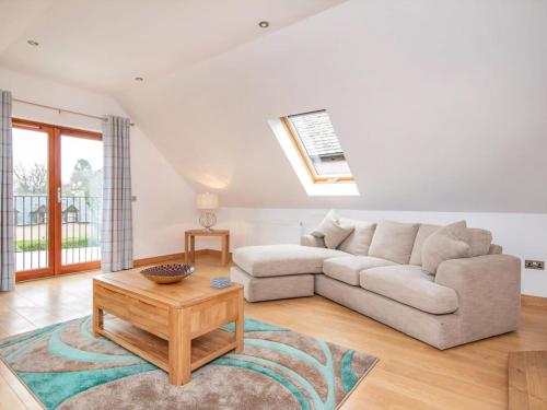 a living room with a couch and a table at The Hive in Dornoch