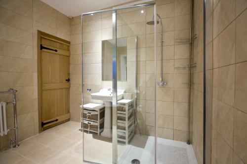 a bathroom with a shower and a sink at Fall in Green in Haworth