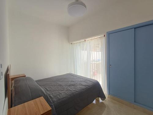 a bedroom with a bed and a window at San bernardo ll in San Bernardo