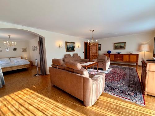 a living room with two couches and a couch at FeWo Reserl in Bischofswiesen