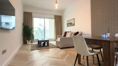 Modern 1BR Retreat with Balcony & Early Check In & Late Check Out Available in Vibrant JVC by Bhavan Vacation Homes
