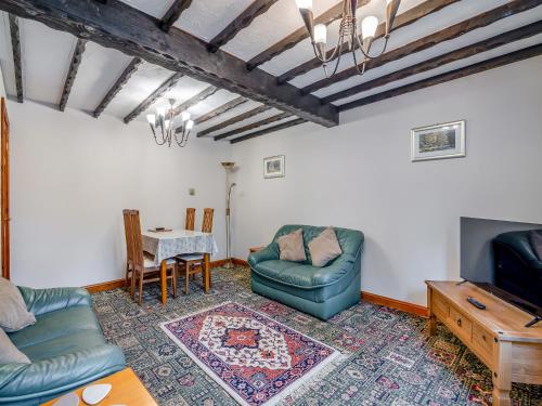 a living room with two couches and a table at Little Barn - 16438 in York