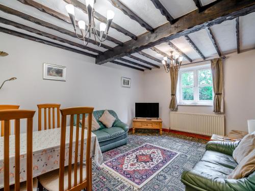 a living room with a couch and a tv at Little Barn - 16438 in York