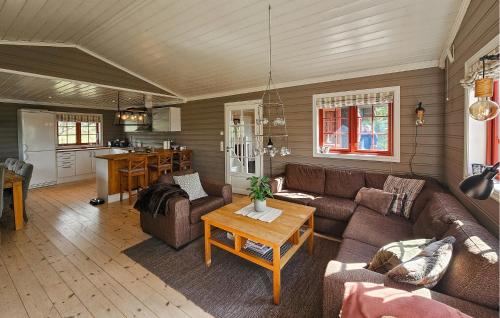 a living room with a couch and a table at Gorgeous Home In Eggedal With Sauna in Eggedal