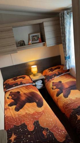 a bedroom with two beds with bears on them at B10 - The Escape Pod in Heysham