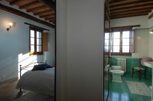 Postel nebo postele na pokoji v ubytování Agriturismo I Pagliai