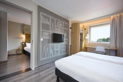 Llit o llits en una habitació de ibis De Haan
