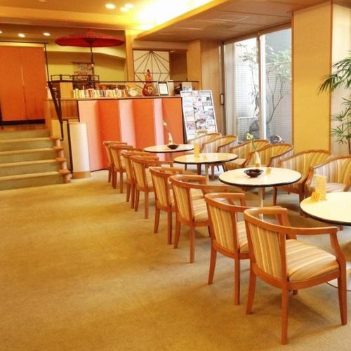 a dining room with tables and chairs in a restaurant at Subaruyado Yoshino in Tokushima