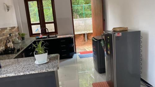 a kitchen with two refrigerators and a counter top at Liya Villa in Ahangama