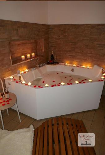 a large bath tub with lights in a room at Villa Iliana in Lucca