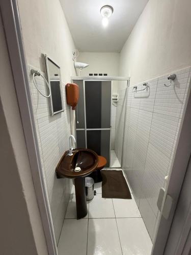a bathroom with a toilet and a shower at Hotel Solaris in Senhor do Bonfim