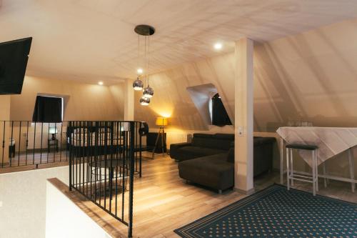 a living room with a couch and a table at Végvári Hotel Eger in Eger