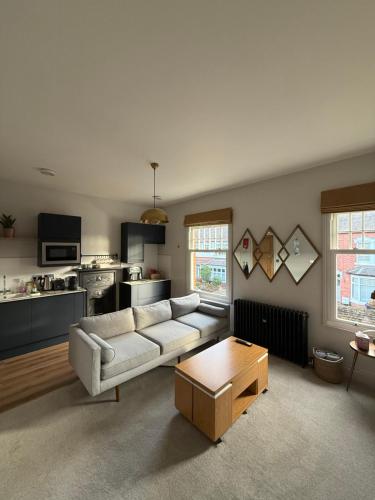 a living room with a couch and a coffee table at West Bridgford 2 Bed 2 Bathroom Apartment with parking in West Bridgford