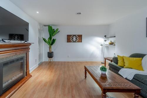 a living room with a couch and a fireplace at Magnifique condo 2 chambres in Beaupré