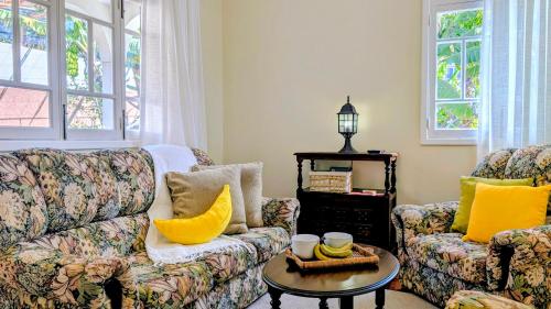 a living room with a couch and a table at Banana Lovers - Farm View in Ribeira Brava