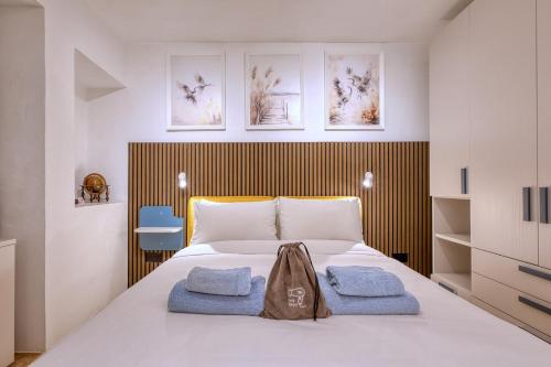 a bedroom with a bed with two towels on it at Beautiful traditional townhouse in the heart of Rabat AMIF2-1 in Rabat