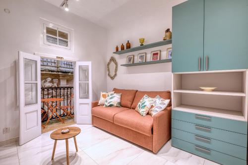 a living room with a couch and a table at Beautiful traditional townhouse in the heart of Rabat AMIF2-1 in Rabat