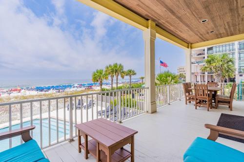 a balcony with a view of the beach at Summer Salt West by Youngs Suncoast in Orange Beach