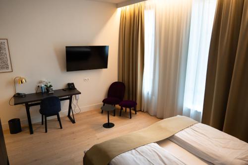 Llit o llits en una habitació de Corsendonk Turnova