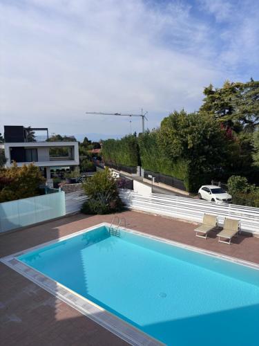 a swimming pool on the roof of a house at Lazise Suite in Lazise