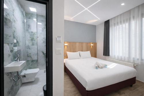 a hotel room with a bed and a sink at Kilic Boutique Hotel in Istanbul