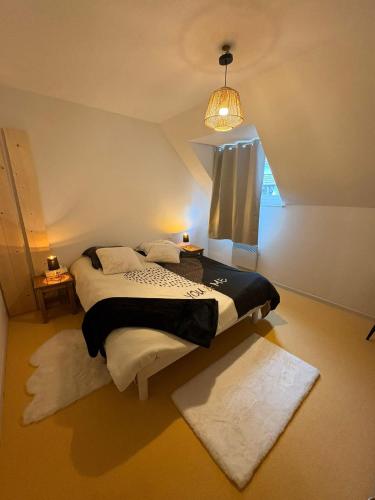 a bedroom with a large bed with a window at "1-2-3 SOLEIL" Duplex - 8 pers - La Mongie Pic d'espade in La Mongie