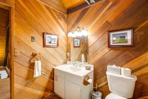 a bathroom with wooden walls and a toilet and a sink at Discount Available! Lake Tahoe Gem w/ Pool Table in South Lake Tahoe