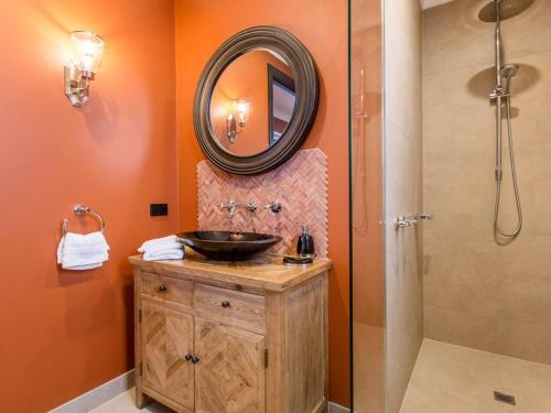 a bathroom with a sink and a mirror at Mt Martha Villas in Mount Martha