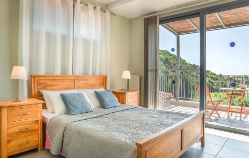 a bedroom with a large bed and a balcony at Villa Giorgio by Villa Select in Kefallonia