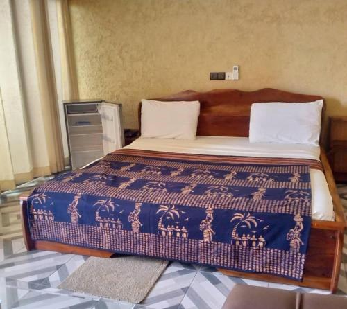 Un pat sau paturi într-o cameră la HOTEL Le KLOTO