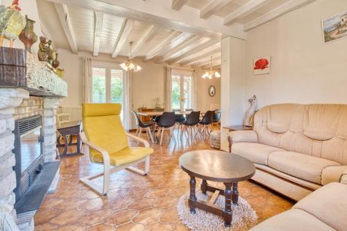a living room with a couch and a fireplace at Quai secret in Niversac