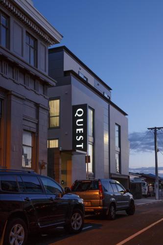 two cars parked in front of a building at Quest Petone in Lower Hutt